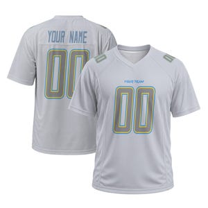 May include: A light gray V-neck jersey featuring the text YOUR TEAM on the front and YOUR NAME on the back. Both sides display the number 00 in gray with yellow and blue outlines. The shoulders also feature small rectangular accents with the number 00.