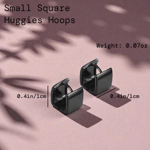 May include: Small square huggie hoops in black, each measuring 0.4 inches (1 cm) across. The earrings have a weight of 0.07 ounces. The image shows two earrings on a pink surface, with the product name at the top.