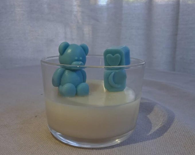 Wax candle in glass container