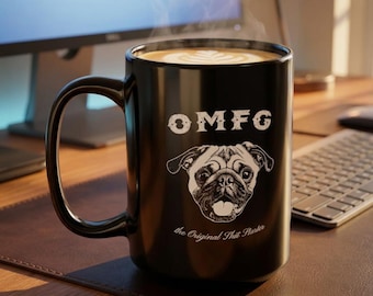 May include: A black ceramic mug filled with coffee featuring a white graphic of a pug face. Above the pug, the text reads OMFG in a distressed font, and below the pug, the text reads the Original Shit Starter in a cursive script font.