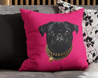 May include: A square throw pillow in a vibrant hot pink colour featuring a centred illustration of a black pug dog wearing a thick gold chain necklace with a round, amber-coloured pendant hanging from the centre of the chain.