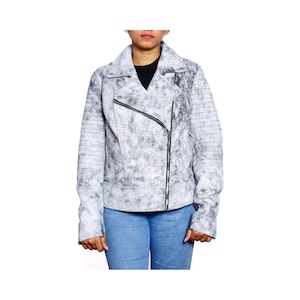 May include: A light gray and black distressed leather jacket with an asymmetrical zipper closure. The jacket has a notched collar and ribbed detailing on the sleeves. The model is wearing blue jeans and a black shirt.