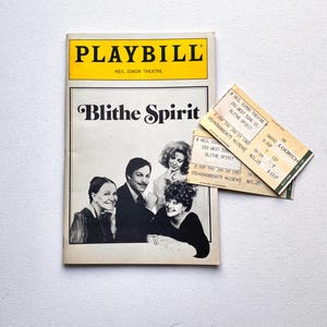 May include: A vintage Playbill from the Neil Simon Theatre for the play "Blithe Spirit" with a yellow banner. Two theater tickets are next to the Playbill. The Playbill cover features a black and white photo of the cast.