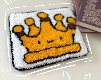 Alfombra artesanal con diseño de corona, alfombra con aguja perforadora, hilo acrílico naranja y blanco para decoración del hogar.