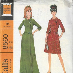 May include: A vintage sewing pattern for a misses' robe in two lengths. The pattern is for size 10 with a bust measurement of 31 inches. The pattern is printed on a white background with orange text and a picture of two women wearing the robe in different lengths. The woman on the left is wearing a green robe and the woman on the right is wearing a red robe with a white pattern.