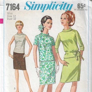 May include: Vintage Simplicity sewing pattern 7164. The pattern features three women's outfits: a striped top with a skirt, a floral print top and skirt set, and a green dress with a tie waist. The pattern includes the text "Jiffy" and "easy cut - easy sew".