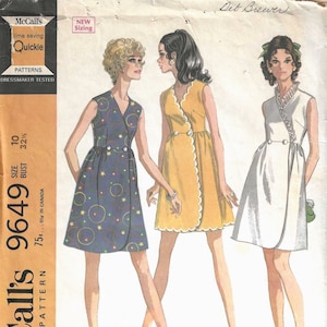 May include: A vintage sewing pattern for a wrap dress. The pattern is for misses' and junior sizes and includes three different styles. The pattern is from McCall's and is called "Quickie" and the pattern number is 9649. The pattern is for a size 10 with a bust measurement of 32 1/2 inches.