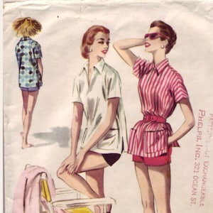 May include: Two women wearing short-sleeved shirts and shorts. The woman on the left is wearing a white shirt and black shorts. The woman on the right is wearing a pink and white striped shirt and red shorts. The woman on the right is holding a straw hat. The text "PATTERNS NOT EXCHANGEABLE, PHELPS, INC., 321 OCEAN ST." is printed on the right side of the image.