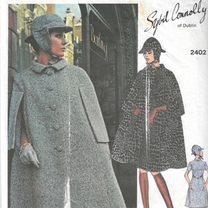 May include: Vintage Vogue Couturier Design sewing pattern featuring two women's coats with a cape style. The pattern is by Sybil Connolly of Dublin and is number 2402.