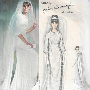 May include: A Vogue Couturier Design sewing pattern envelope, number 1347 by John Cavanagh of London. The front displays a photograph of a white wedding gown with a veil and a matching illustration showing the dress design from front and back views.