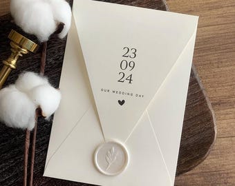 Handmade Wedding Invitation Set: Elegant, textured card with seal. Customizable design.