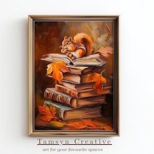 Könnte beinhalten: Gerahmtes Gemälde mit einem Eichhörnchen auf einem Bücherstapel und Herbstblättern. Das Kunstwerk verwendet warme Farben wie Braun, Orange und Grün. Der Text "Tamsyn Creative" befindet sich unten. Das Gemälde hat einen goldenen Rahmen.