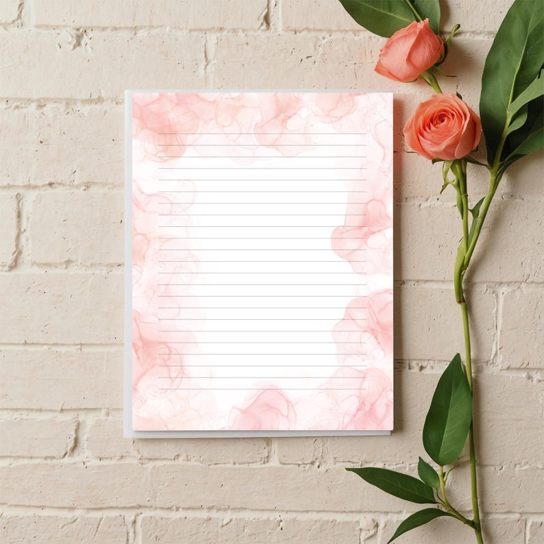 May include: Pink and white lined stationery paper with a watercolor-style background. The paper has a subtle pink and white design that resembles clouds or smoke.