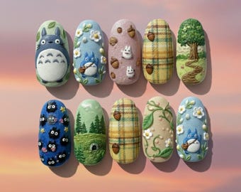 May include: A set of ten almond-shaped nail designs featuring various themes. Designs include cartoon characters, plaid patterns, and nature scenes with trees and flowers. Colors include blue, green, yellow, and pink, with detailed 3D elements.