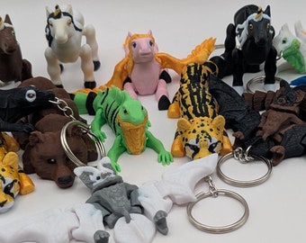 Juguete de escritorio de animal misterioso / Llavero pequeño de amigo inquieto