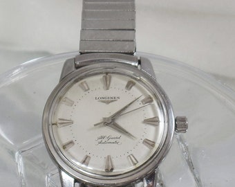 Herenhorloge. Longines Horloge.  Vintage Herenhorloge. 1956 All Guard Automatic Herenhorloge. Roestvrijstalen Longines Horloge. Waalaa.