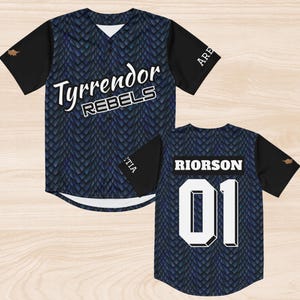 May include: A baseball jersey with a blue scale pattern and black sleeves. The front displays "Tyrrendor Rebels" in white script. The back has "Riorrson" and the number "01" in white.