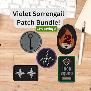 May include: A collection of embroidered patches, including a key, lightning bolt, and a flame with the number 2. The patches are various shapes and colors, with the text "Violet Sorrengail Patch Bundle!" and "Iron Squad".