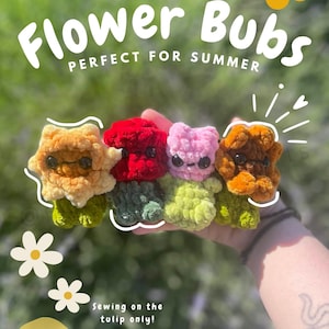 May include: Four small, plush, crocheted flower figures in yellow, red, pink, and brown, each with dark eyes and green stems. The image includes text: Flower Bubs, PERFECT FOR SUMMER, Sewing on the tulip only!, low-sew, DIGITAL PDF DOWNLOAD, @emilybemilyscrafts.