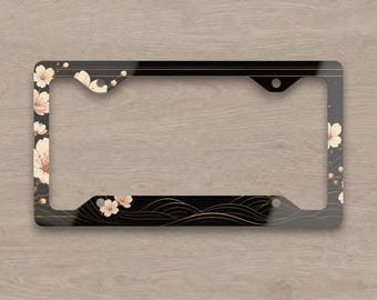 Cadre de plaque d'immatriculation Sakura noir, accessoire de voiture motif fleurs de cerisier japonaises, design floral doré ondulé, cadeau décoratif automobile élégant et esthétique