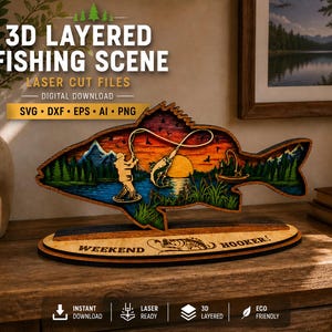 Puede incluir: Una escena de pesca de madera en 3D en forma de pez, con una puesta de sol, montañas y un pescador. La base dice "WEEKEND HOOKER!" e incluye el texto "3D LAYERED FISHING SCENE" y "LASER CUT FILES".
