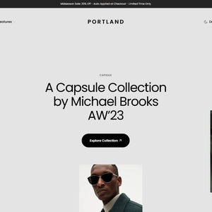 May include: Website homepage promoting a capsule collection by Michael Brooks for AW'23. The page includes images of models wearing clothing, a call to action button, and the brand name "PORTLAND". The website has a dark mode option.