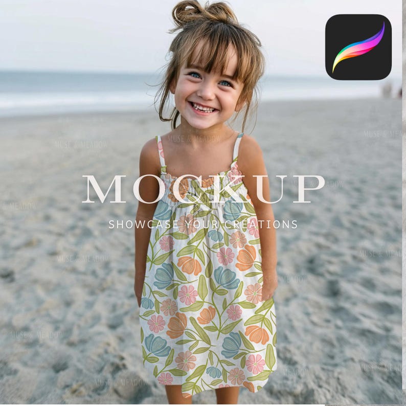 May include: A young girl wearing a floral print dress with a scoop neckline and spaghetti straps. The dress features a pattern of orange, blue, and pink flowers with green leaves. The text "MOCKUP" and "SHOWCASE YOUR CREATIONS" are displayed on the dress.