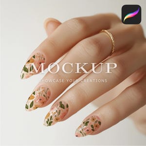 May include: A hand with long, almond-shaped nails adorned with floral nail art in shades of peach, green, and gold. The nails feature a delicate pattern of flowers and leaves. The word "MOCKUP" and the phrase "SHOWCASE YOUR CREATIONS" are visible on the image.
