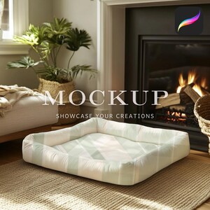 May include: A white and green patterned dog bed with a raised edge. The bed is sitting on a light brown rug in front of a fireplace.