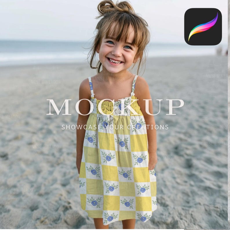 May include: A young girl smiles while wearing a yellow and white checkered dress with blue floral accents. The dress has thin straps and the text "MOCKUP SHOWCASE YOUR CREATIONS" is displayed in white across the image. The background is a sandy beach.