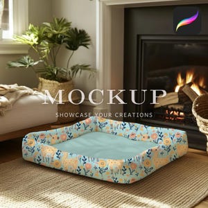 May include: A light blue pet bed with a floral pattern featuring yellow and pink flowers and small yellow llamas. The bed is sitting on a light brown rug in front of a fireplace.