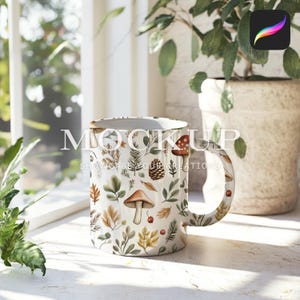 May include: White ceramic mug with a fall-themed design featuring mushrooms, leaves, and pine cones. The text "Showcase Your Creations" is printed on the mug.