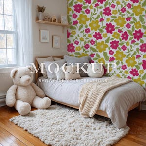 May include: A cozy bedroom scene featuring a light wood bed frame, a large teddy bear, and a fluffy rug. The bed is made with neutral-toned bedding and decorative pillows. A floral wallpaper with pink and yellow flowers adds a pop of color.