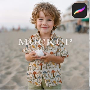 May include: A child wearing a white button-down shirt with a mushroom and floral print. The shirt has short sleeves and a button-up closure. The child is holding a white seashell in their hands. The text "MOCKUP SHOWCASE YOUR CREATIONS" is printed on the shirt.