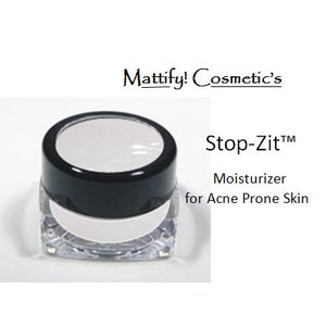 May include: A small, clear jar with a black lid, containing a white substance. The text "Stop-Zit™ Moisturizer for Acne Prone Skin" is displayed next to the jar. The brand name "Mattify! Cosmetic's" is also visible.