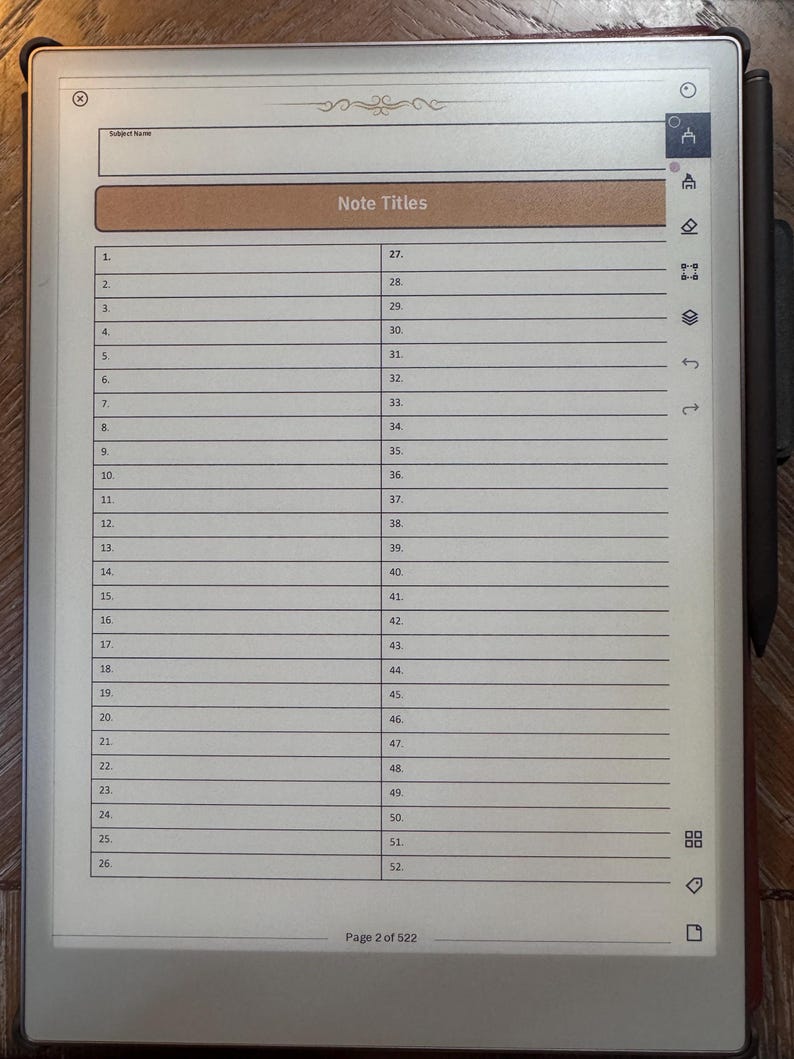 May include: A digital tablet displaying a lined page with the title "Note Titles" and numbered lines. The tablet has a stylus attached and a decorative border at the top. The page number is 2 of 522.