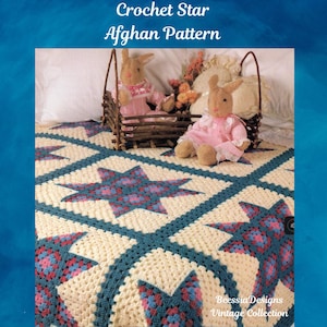 May include: A crocheted afghan pattern with a star design. The blanket features cream-coloured squares with teal borders and star patterns in shades of pink, blue, and purple. The text "Crochet Star Afghan Pattern" is at the top.