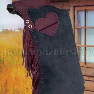 May include: Black suede chaps with burgundy heart-shaped accents and fringe. The chaps feature decorative stitching and metal eyelets. The text "BalalamazingShop" is visible on the chaps.