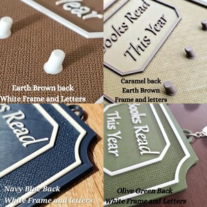 May include: Four close-up images of decorative plaques with the text "Books Read This Year" and "Year". The plaques have different colored backs: earth brown, caramel, navy blue, and olive green. Each plaque has a white frame and letters.
