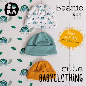 May include: Three baby beanies in white, teal, and mustard yellow. The white beanie has a turtle and rainbow pattern. The teal and mustard beanies are solid colors. Text on the image says "Beanie", "Size 44-86", and "cute BABYCLOTHING".
