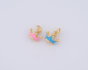 May include: Two gold crown charms with enamel accents. One charm is pink and the other is blue.