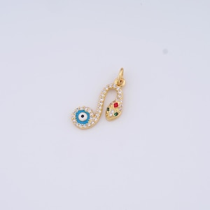 May include: Gold pendant featuring a snake with an evil eye charm. The snake is adorned with clear cubic zirconia stones and has red, green, and blue enamel accents.