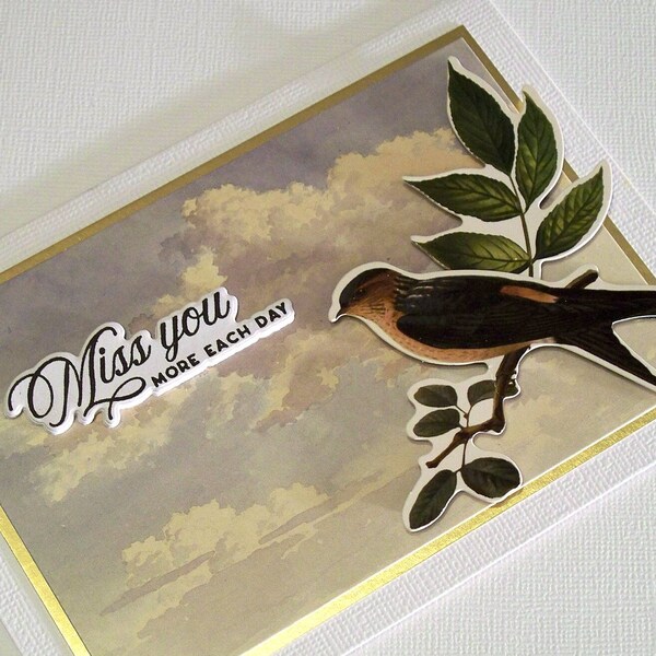 Handmade Miss You Card Features Cloudy Sky Scene, Large Bird on a Branch with the Die-Cut Phrase Miss You More Each Day and Gold Card Stock