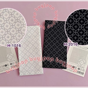 May include: Three fabric samples with geometric patterns. One is white with a gray pattern, another is black with a white pattern, and the third is white with a gray pattern. Each sample has a tag with the text "H-1016" or "H-2016".