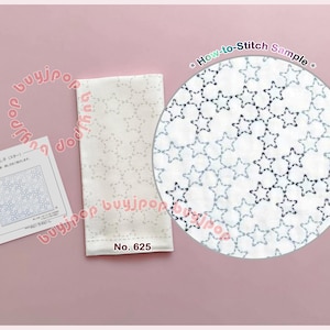 May include: A white fabric cloth featuring a repeating star pattern, accompanied by an instructional card labeled No. 625 and a circular inset showing a How-to-Stitch Sample with dark blue thread outlining the star shapes on the white fabric.