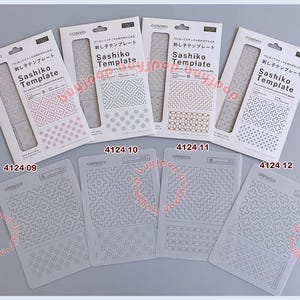 May include: A collection of Sashiko templates for precise stitching guides. The templates feature various geometric patterns and designs, including floral and grid-like motifs. Each template is labeled with a number and the brand name Cosmo.