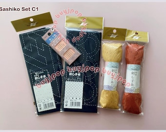 Zestaw startowy Sashiko C1 i C2 - Japan Naska DIY Zestaw Sashiko 2 Wzór na granatową tkaninę 2 motki x 80 m nici + 6 igieł