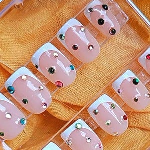 French tip rhinestone nails Jeweled Press on Nails perfect for Spring. Gel pink and white nails short square nails with bling. Trending art