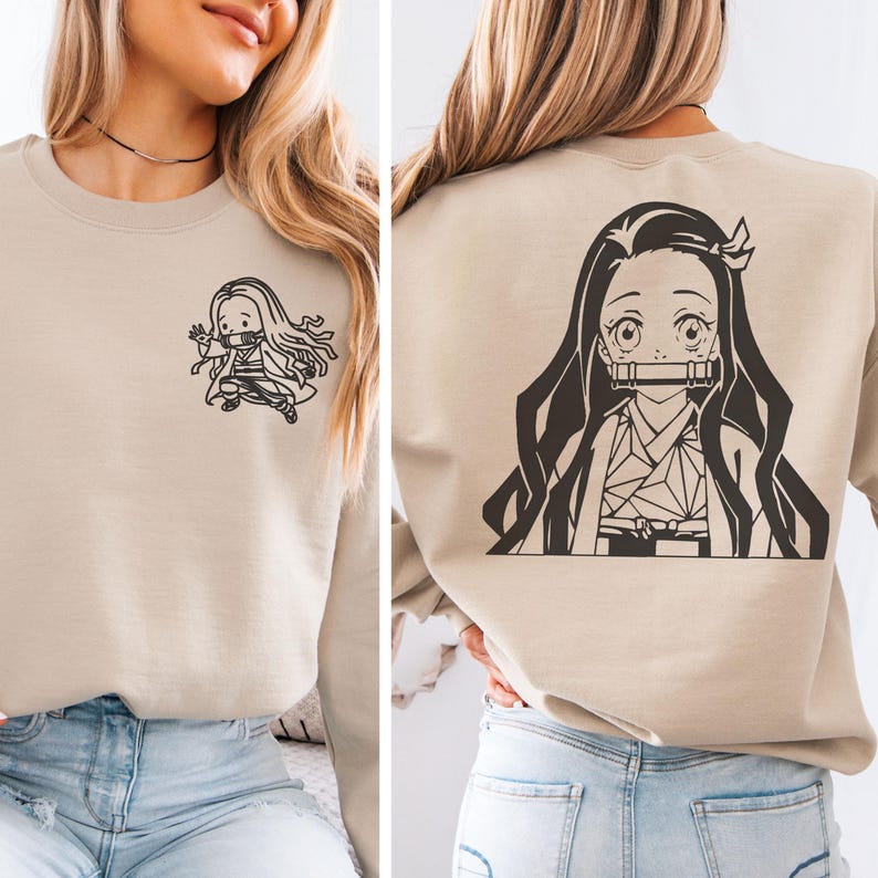 May include: A beige crewneck sweatshirt featuring a small black line art graphic of an anime character on the front left chest and a large black line art graphic of the same character on the back, depicting a girl with long hair and a bamboo muzzle.