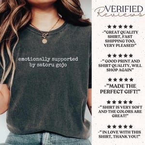 May include: A charcoal grey short-sleeve t-shirt with the white text "emotionally supported by satoru gojo" printed on the chest. To the right, a list of five-star verified reviews includes text praising the shirt quality and shipping.